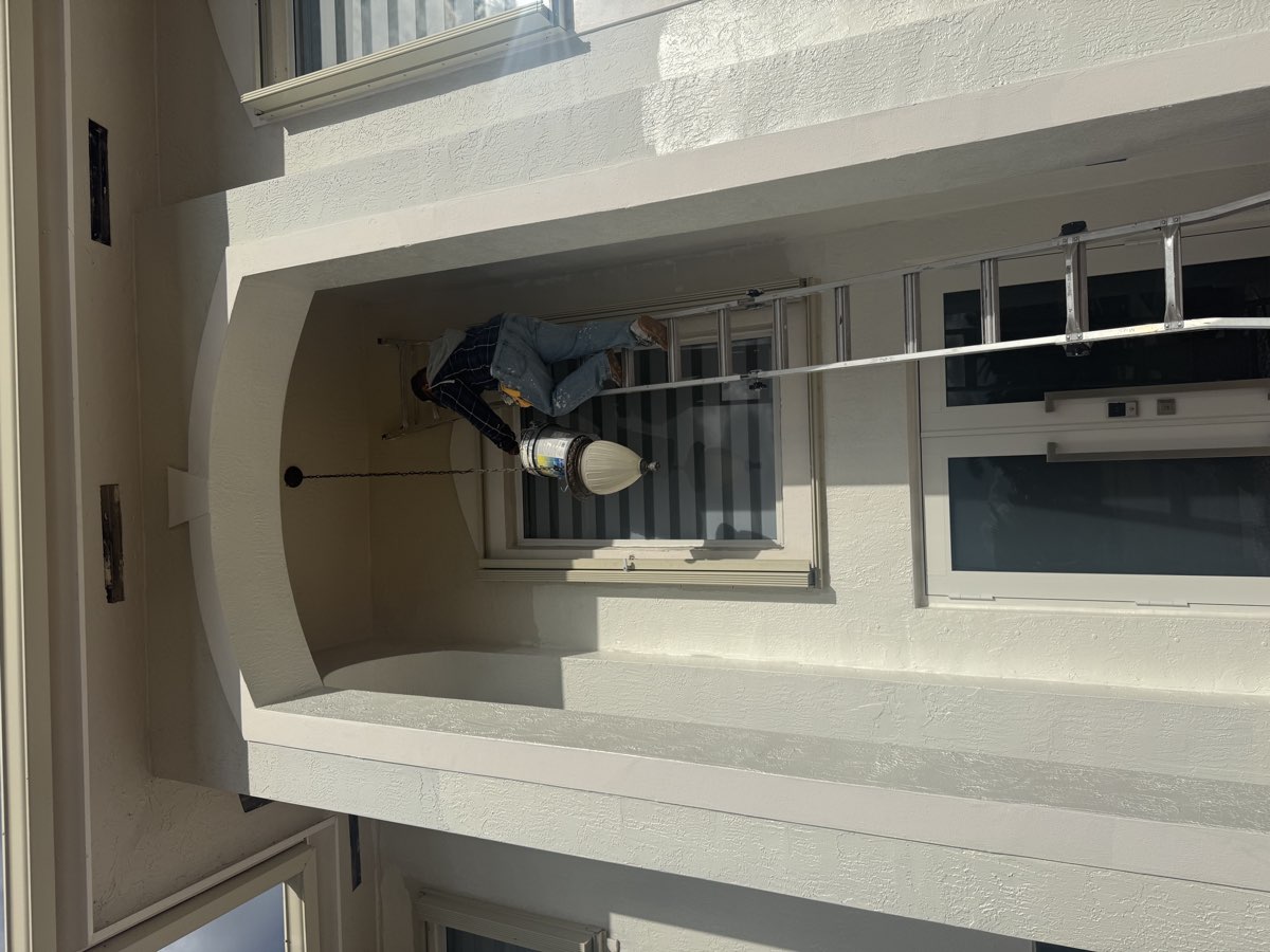 Exterior house painting near tall entrance in The Hammocks Miami